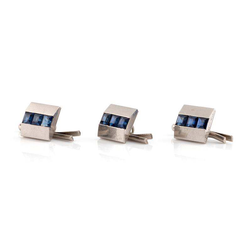 Boucheron, three shirt buttons, platinum and step cut sapphires.