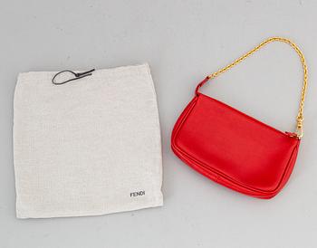 FENDI, a red hand bag.