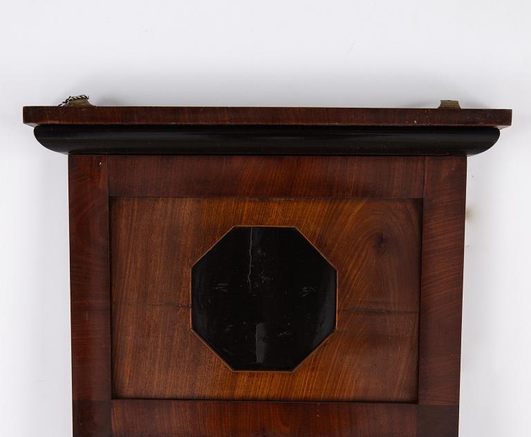 A pair of Biedermeier mahogany mirrors and one console table, 19th century.