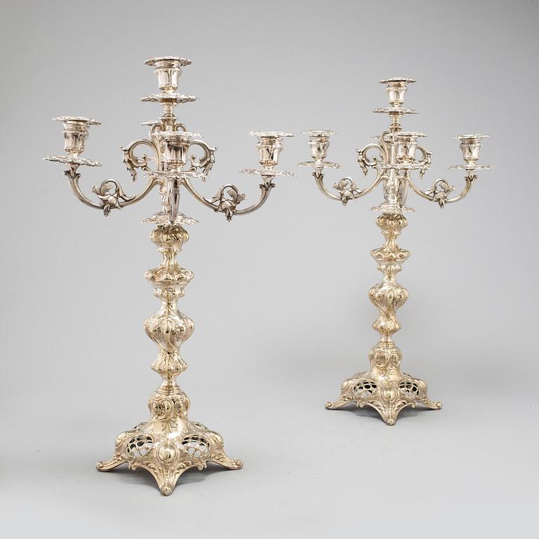 A pair of silver plate candelabra, 20th century.