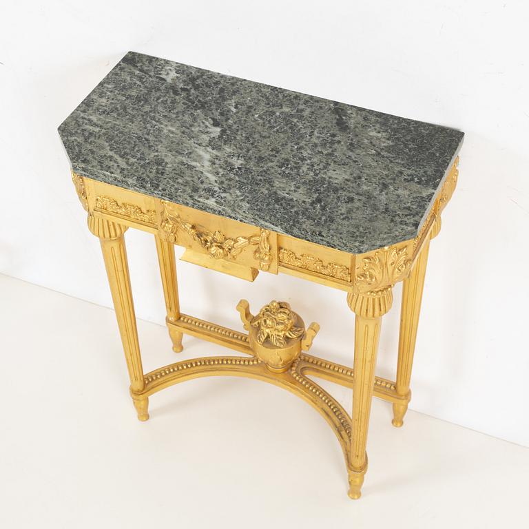 A Gustavian style console table and mirror, mid 20th century.
