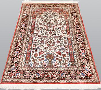 A Ghom silk carpet, approx. 206 x 135 cm.