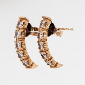 Korvakorut, 14K kultaa ja briljanttihiottuja timantteja.