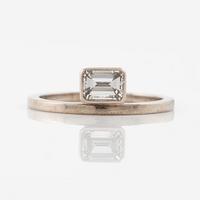 Ring, 14K white gold with emerald-cut diamond.