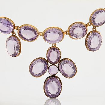 A necklace and a pair of earrings in silver set with amethysts.