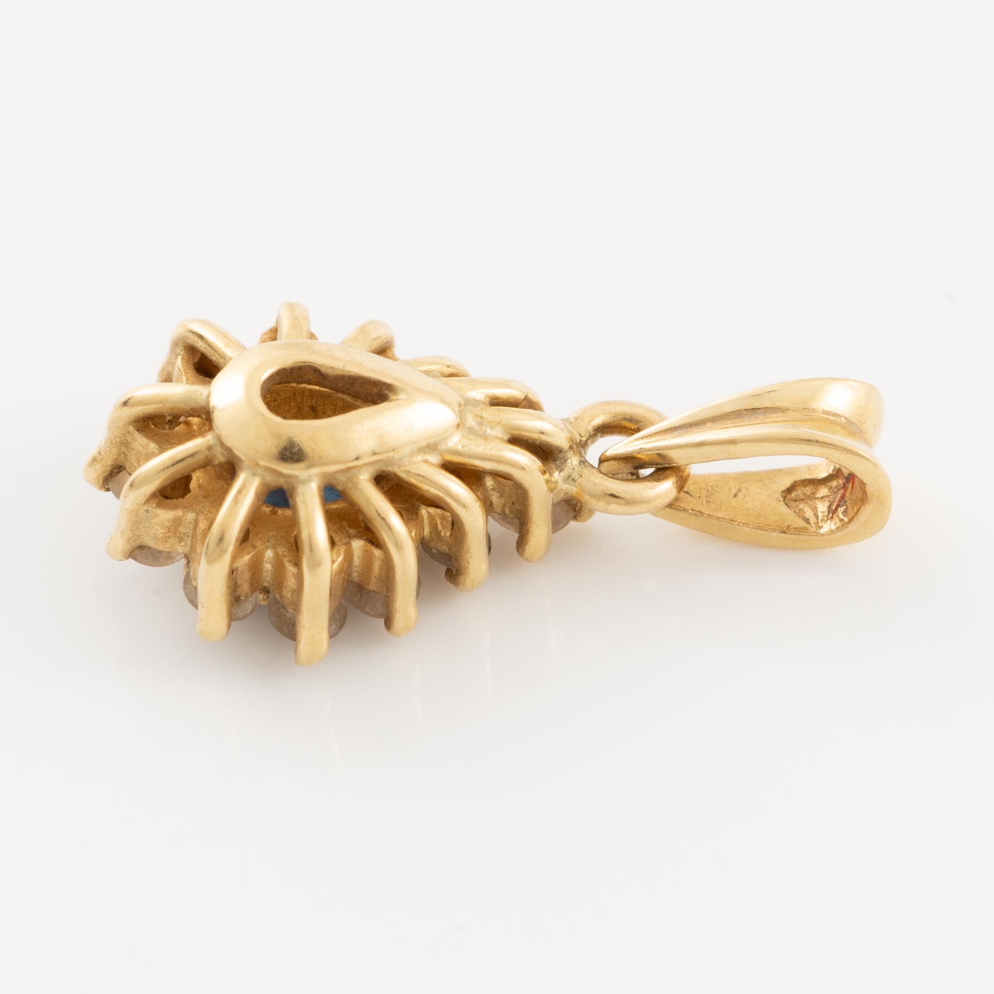 Pendant, 18K gold, set with a sapphire and brilliant-cut diamonds.