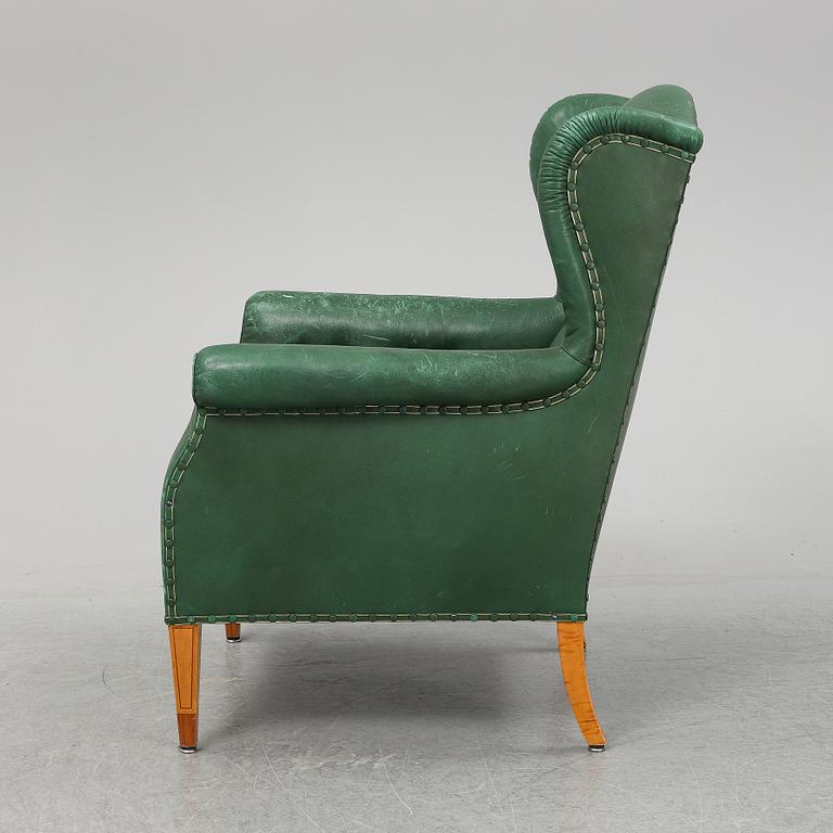 A leather wing-chair.