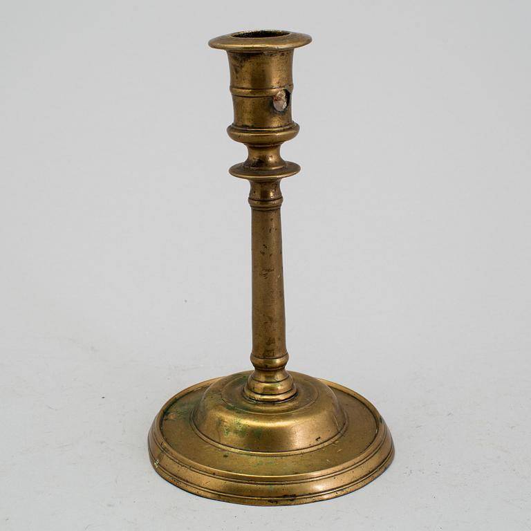 A 1500s bronze candlestick.