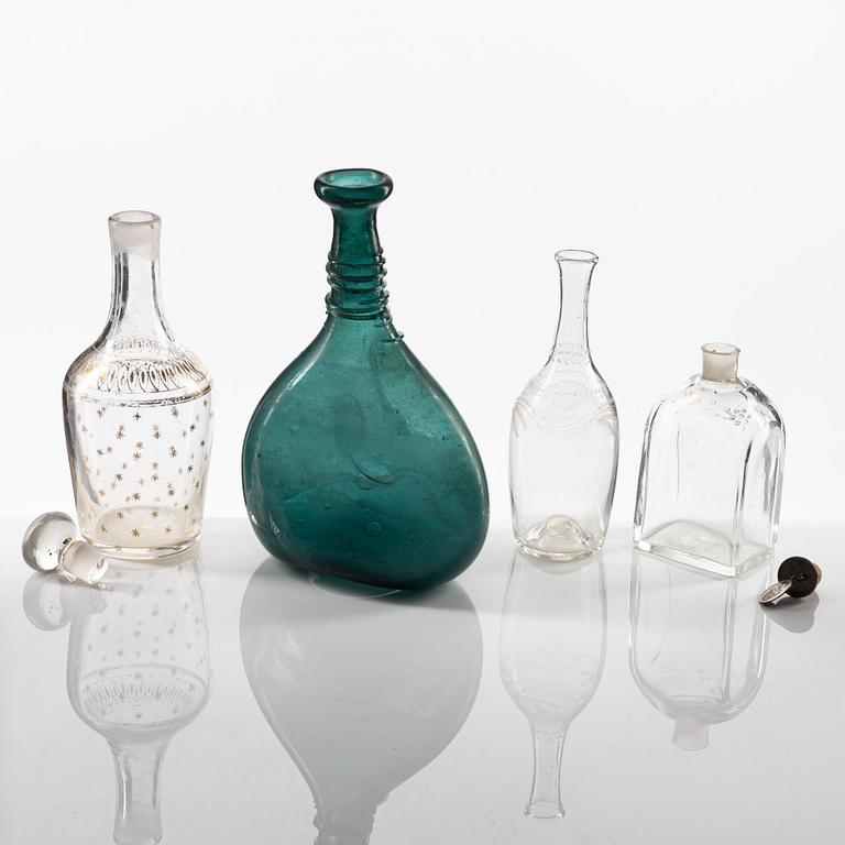 A set of eight glass bottles and decanters, circa 1800/19th Century.