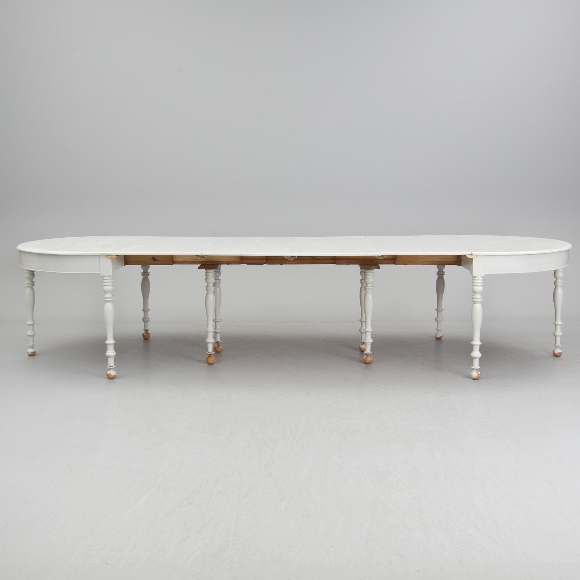 A mid 19th century dining table with six extension leaves.