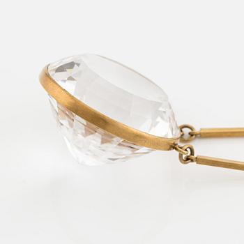 Wiwen Nilsson, an 18K gold necklace with a rock crystal pendant, Lund 1975.