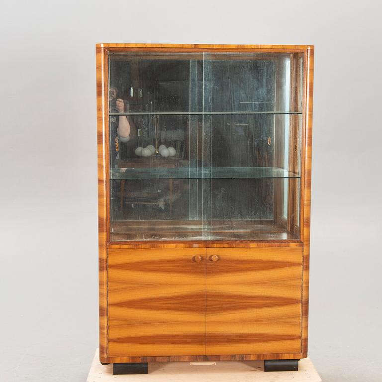 A 1930/40s walnut display cabinet.