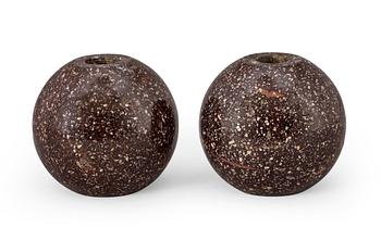 747. A pair of circa 1900 porphyry candlesticks.