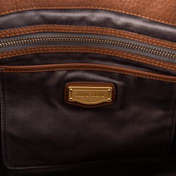 Miu Miu, a leather bag.