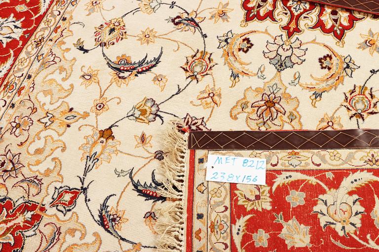 A semi-antique part silk Isfahan rug, a. 238 x 156 cm.