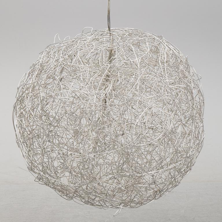 A 'Fil de Fer Ovale' ceiling light by Enzo Cattelini.
