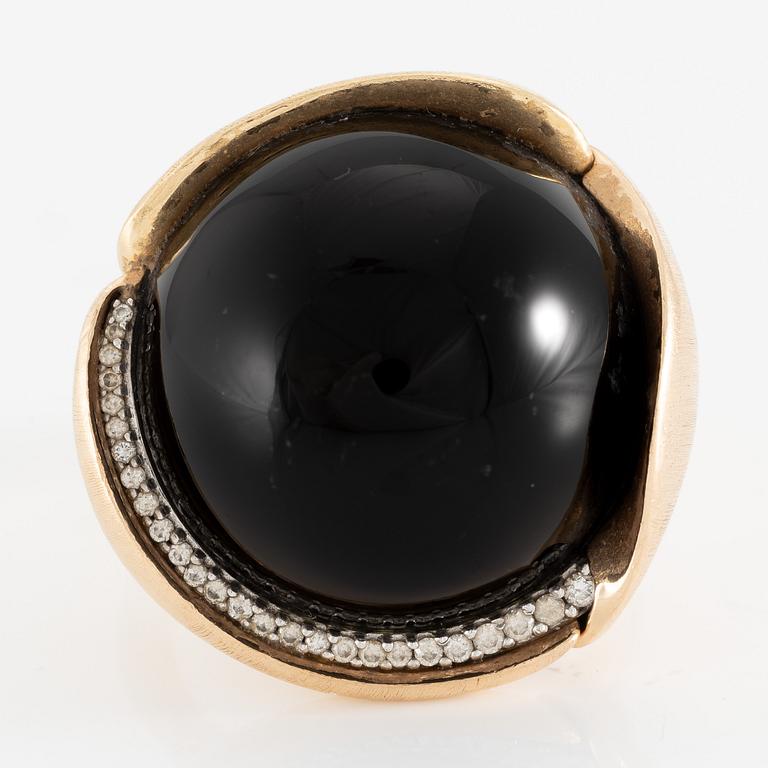 Ole Lynggaard, ring, large Lotus, 18K gold with cabochon-cut black stone probably onyx with brilliant-cut diamonds.