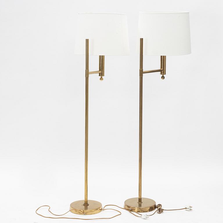 A pair of model 'G-18' brass floor lights, Bergboms, second half of the 20th Century.