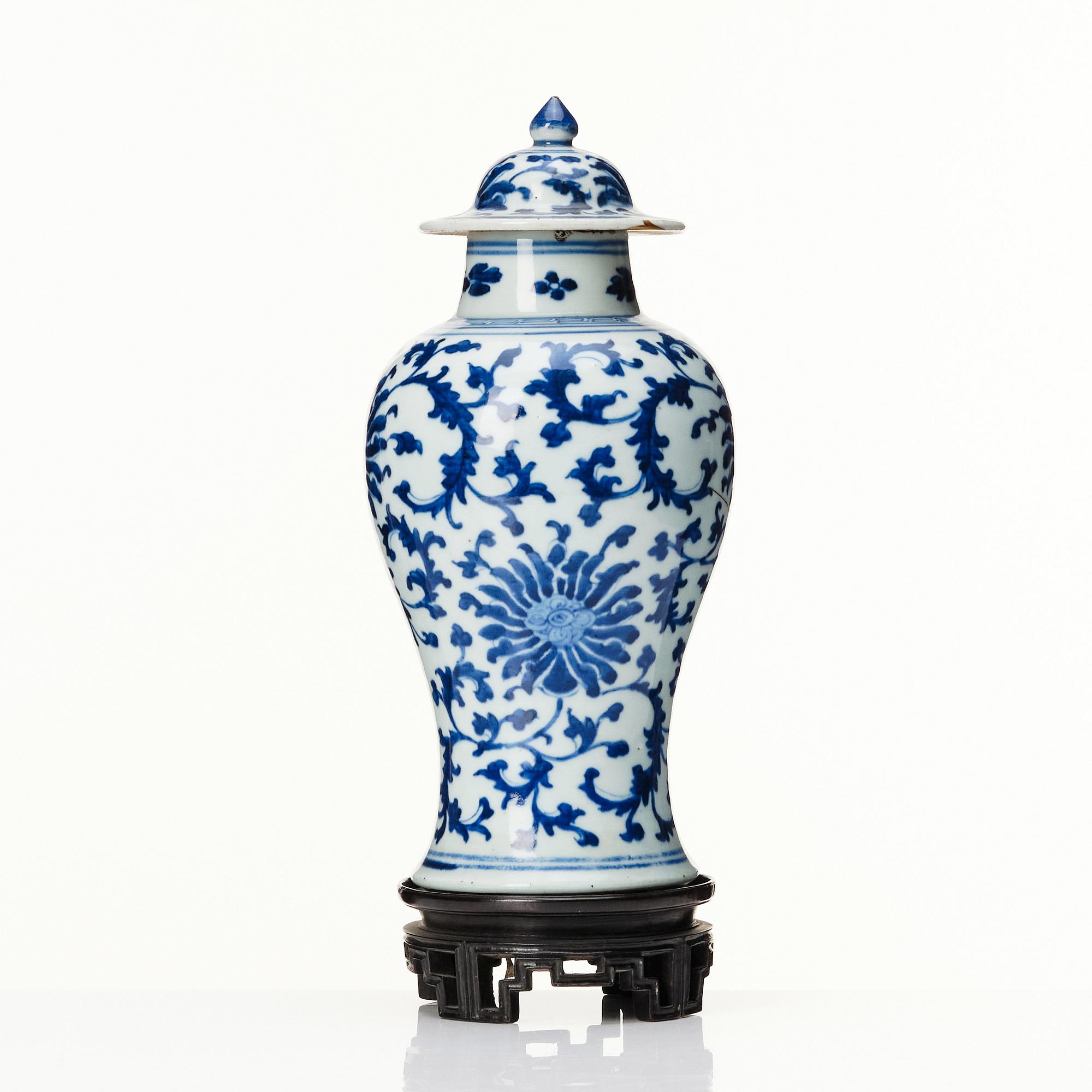 A Chinese blue and white lotus vase with cover, Qing dynasty, 18th Century.
