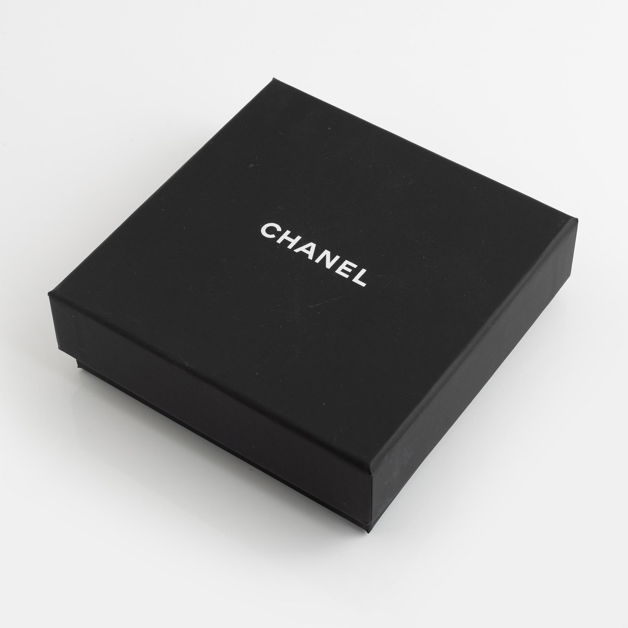 Chanel, a pair of silvermetal and rhinestone earrings, 2018.