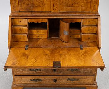A Swedish rococo burr-alder veneered cabinet, later part 18th century.
