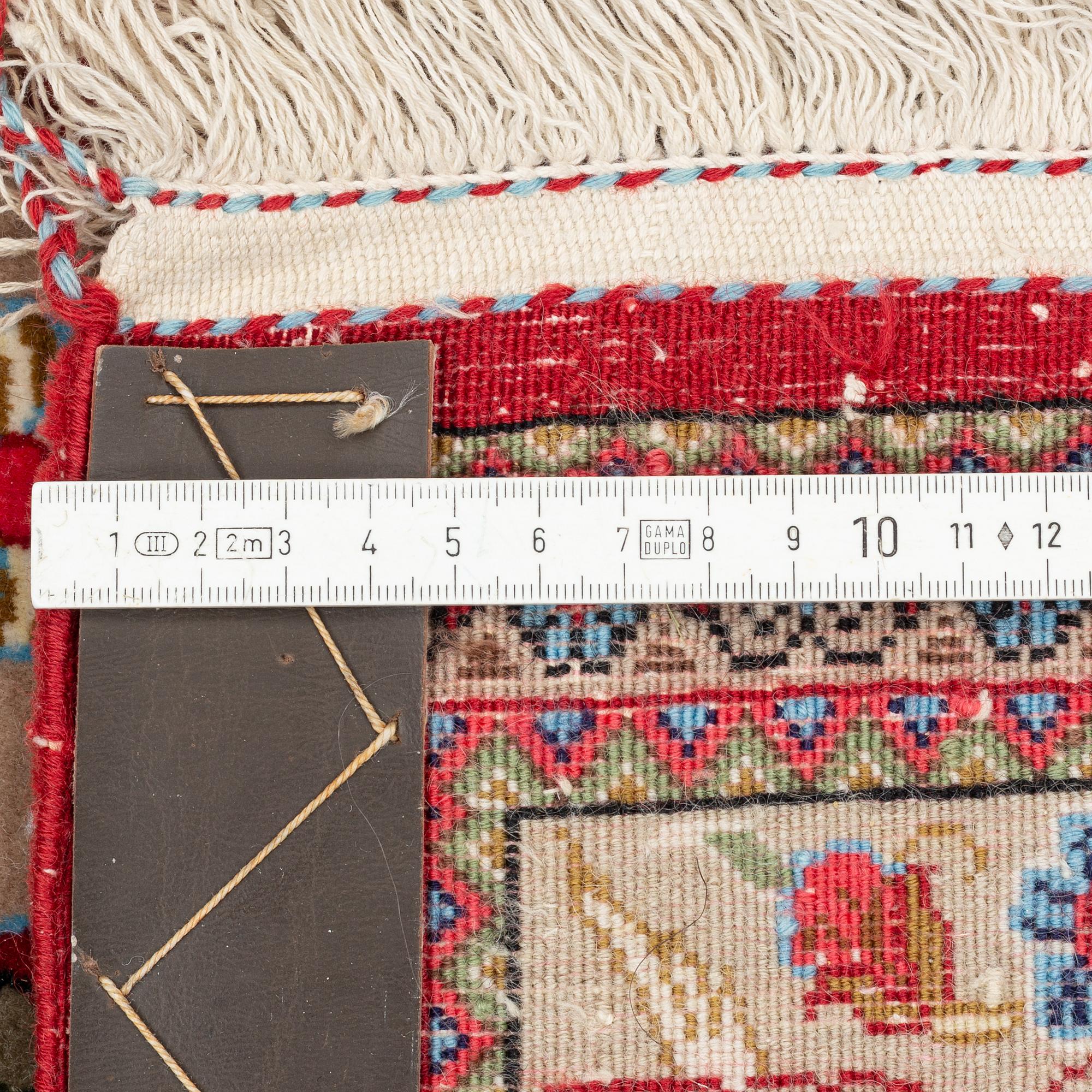 A Ghom rug, c. 160 x 105 cm.