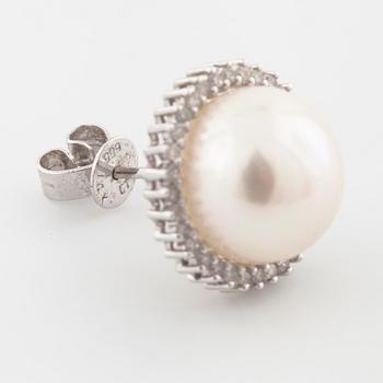 A pair of mabe pearl and brilliant cut diamond earrings.