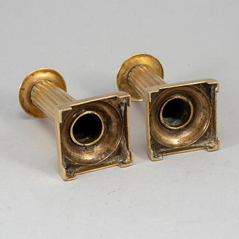A pair of Louis Seize bronze candlesticks, late 18th century.