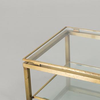 A BRASS GLASS TOP COFFEE TABLE.