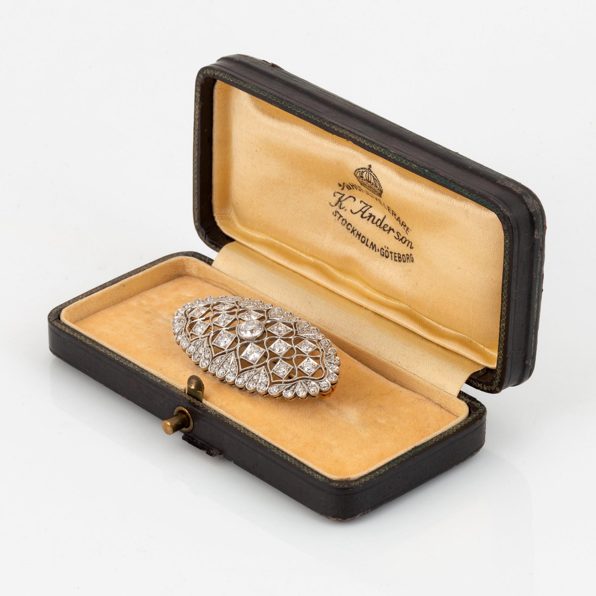 A platinum and gold brooch set with old-cut diamonds.