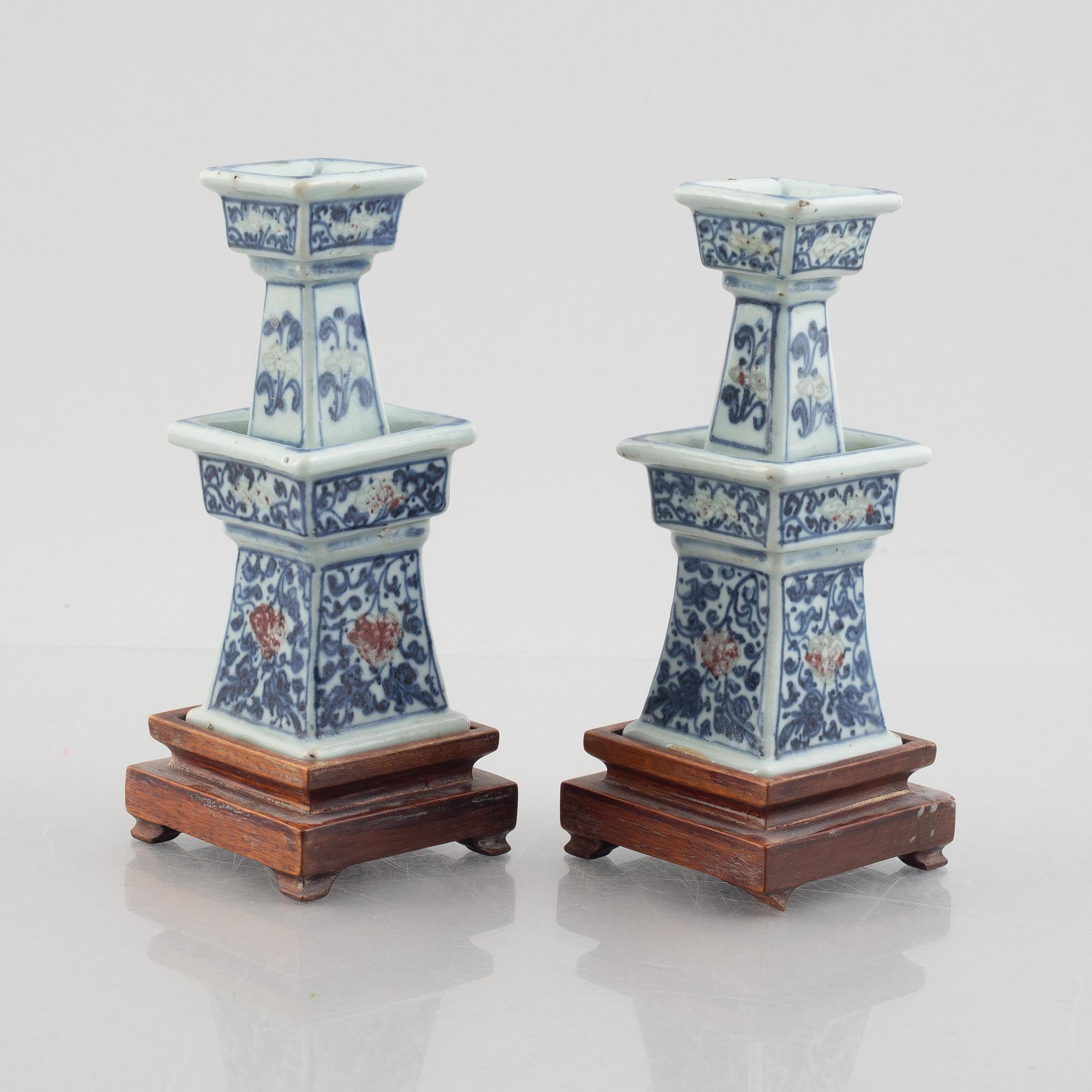 A pair of Chinese porcelain altar sticks, late Qing dynasty.