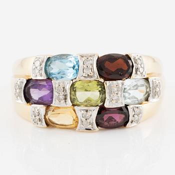 Ring, 18K gold with an oval-cut topaz, garnet, amethyst, peridot, aquamarine, as well as citrine and octagonal-cut diamonds.