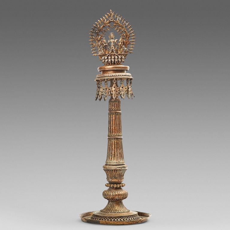 A copper alloy temple lamp, Nepal, circa 1900.