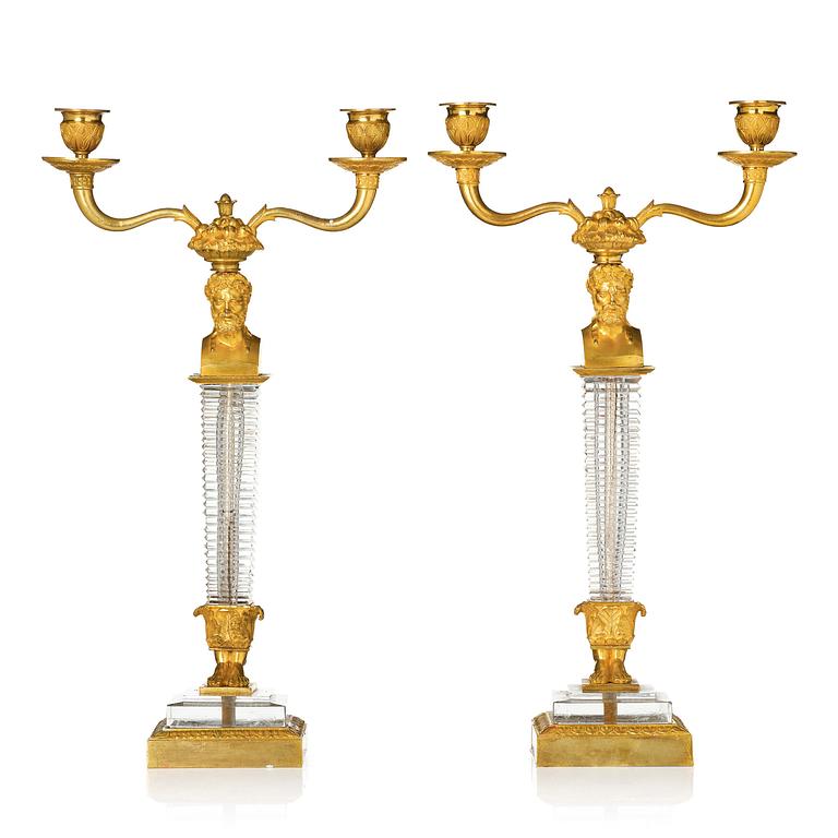 A pair of Empire ormolu and cut glass two-branch candelabra, Paris, early 19th century.