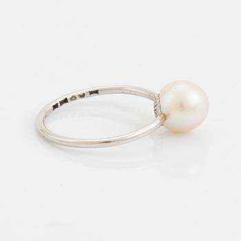 White gold earrings and ring with pearl and white stones.