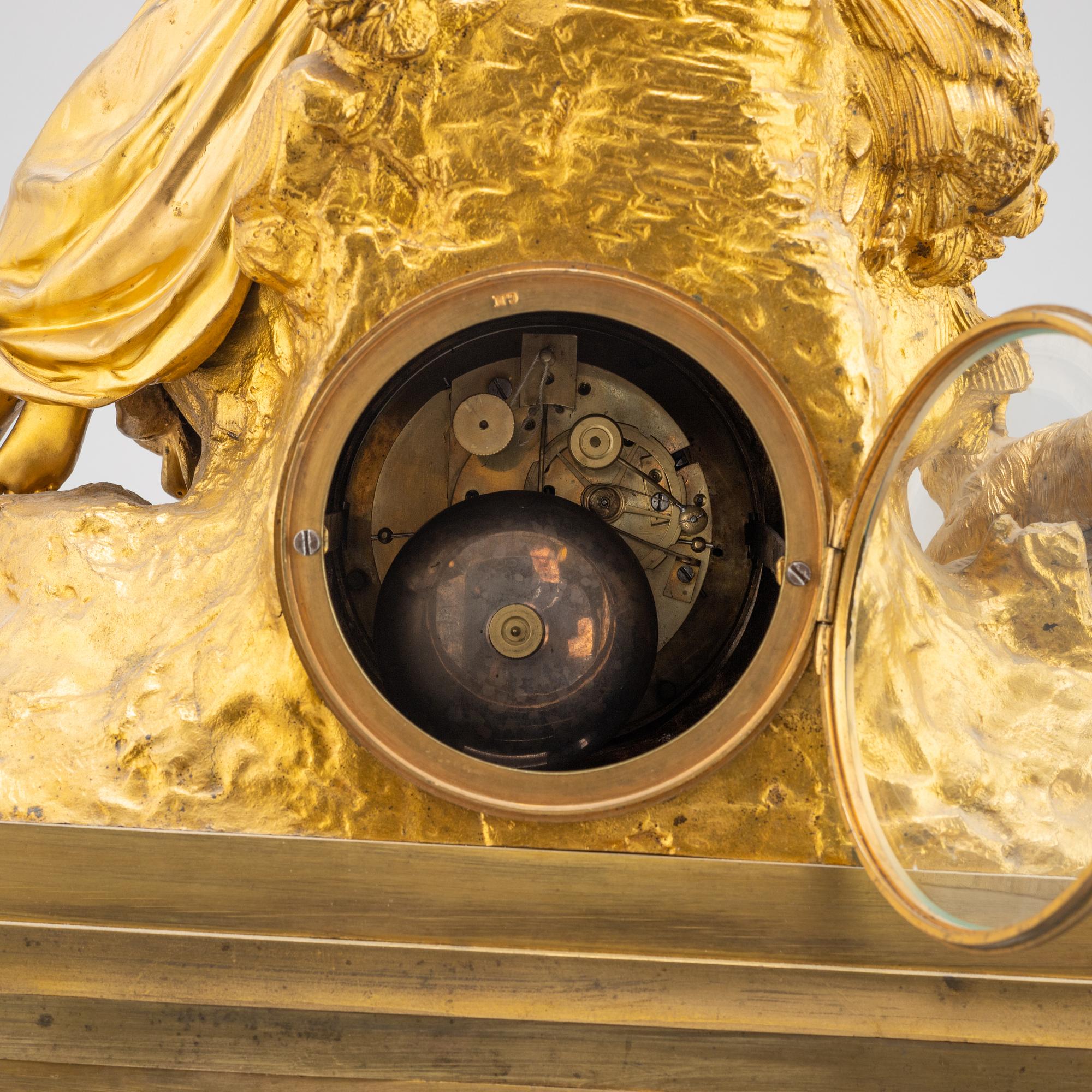 A mid 19th Century brass and gilt brass mantel clock.