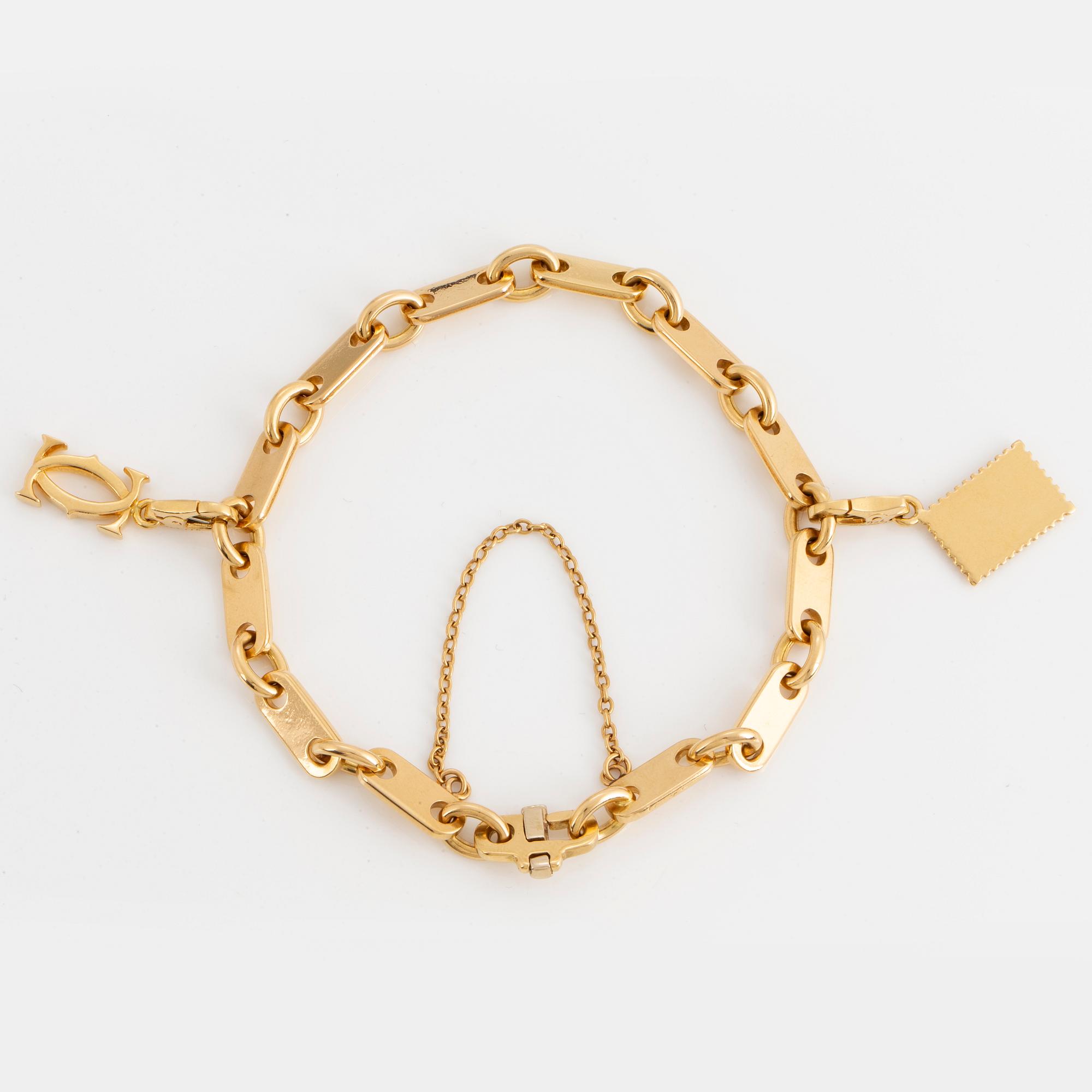 Cartier 18K gold charm bracelet.