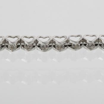 ARMBAND, 18K vitguld med briljantslipade diamanter ca 0.93 ct. Vikt 4,8 gram.
