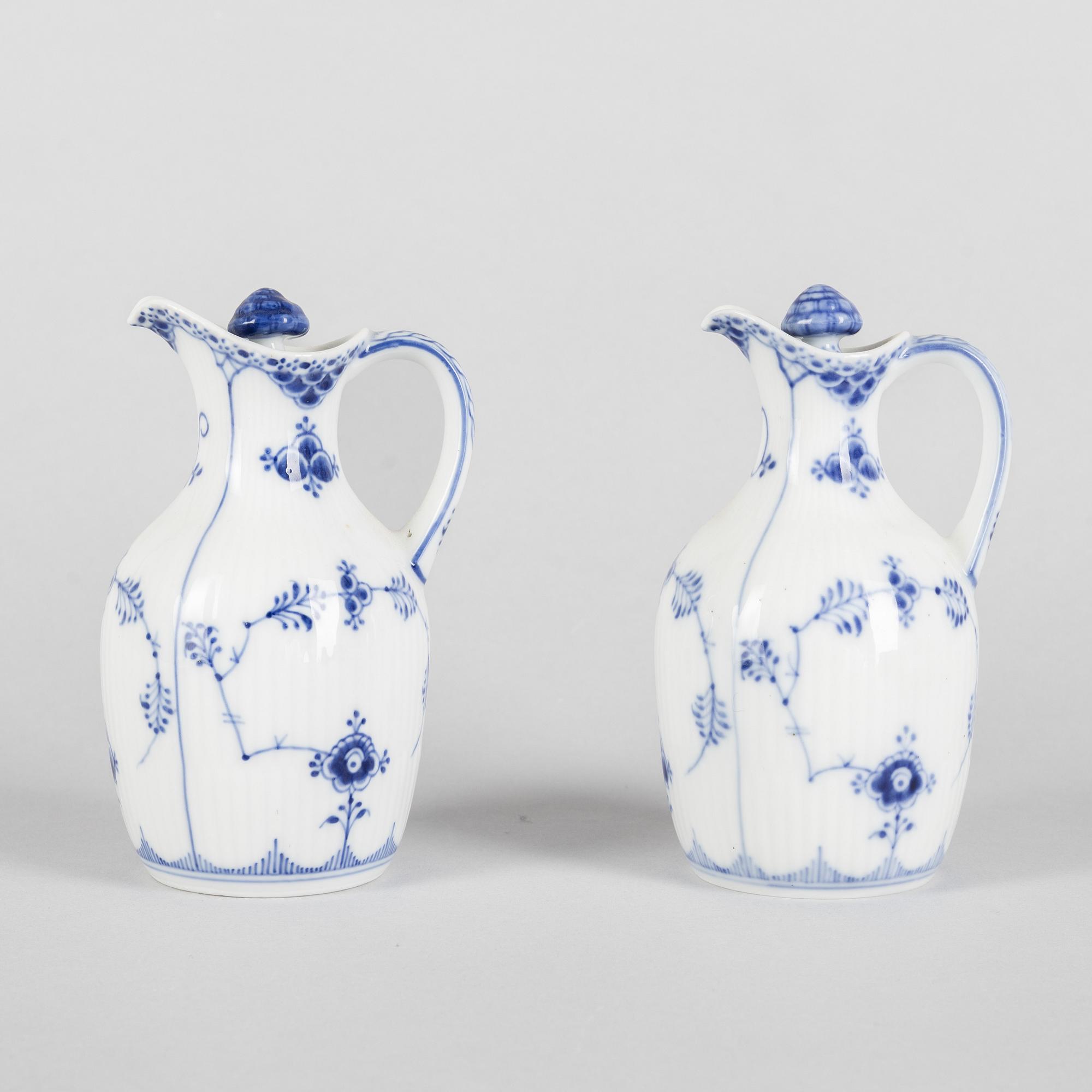 A pair of 'Blue Fluted' porcelain oil and vinegar pitchers and a tray, Royal Copenhagen, models 1179, 1180 and 1195.
