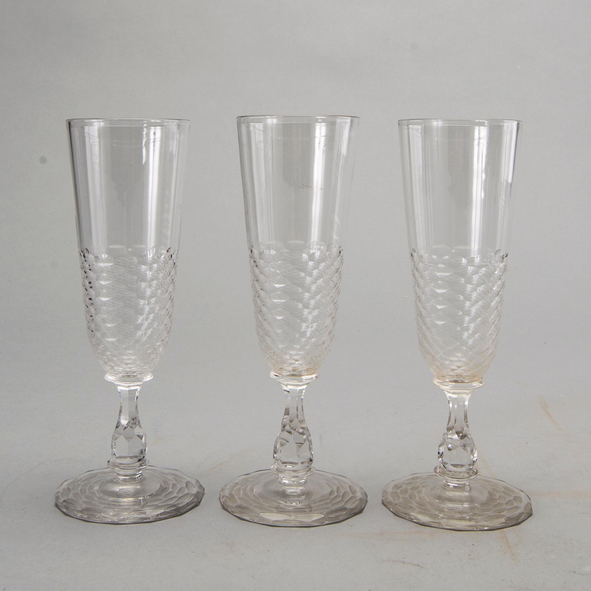 10+7 Champagne glasses, decanter, cut decor. First half of 20th century.