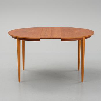 A teak dining table with 4 'Monaco' chairs, mid 20th century.