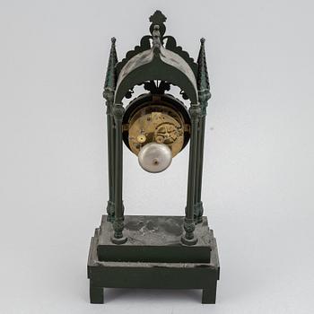 A cast iron gothic revival mantel clock, late 19th century.