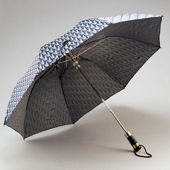 CHRISTIAN DIOR, a set of a clutch, a belt and an umbrella.
