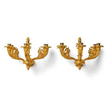 158. A pair of French Empire six-branch ormolu appliques, ca 1820's.