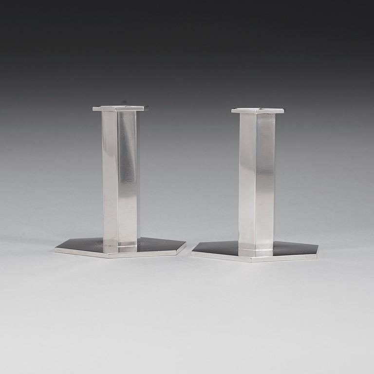 A pair of Wiwen Nilsson sterling candlesticks, Lund 1961 & -67.