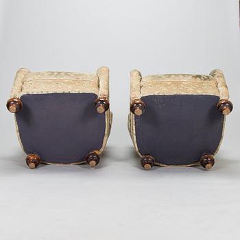 A pair of mid-20th-century armchairs.