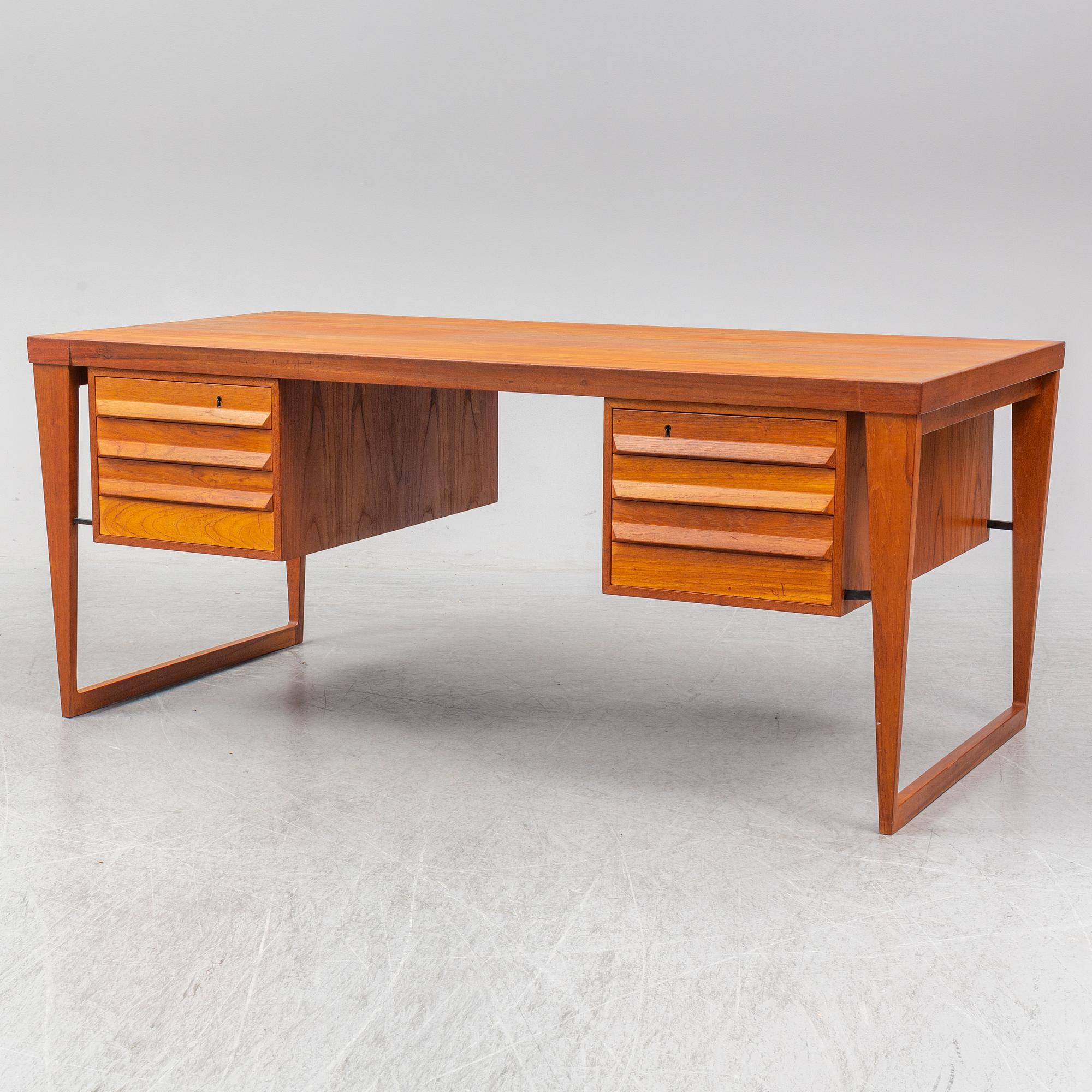 A 1960's teak model 70 writing desk by Kai Kristiansen.