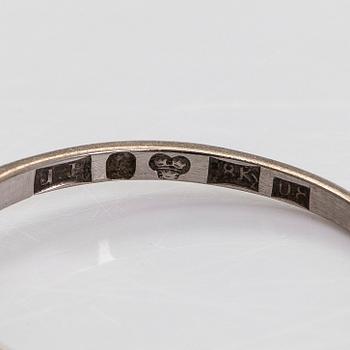 Ring, 18K vitguld med briljantslipad diamant.