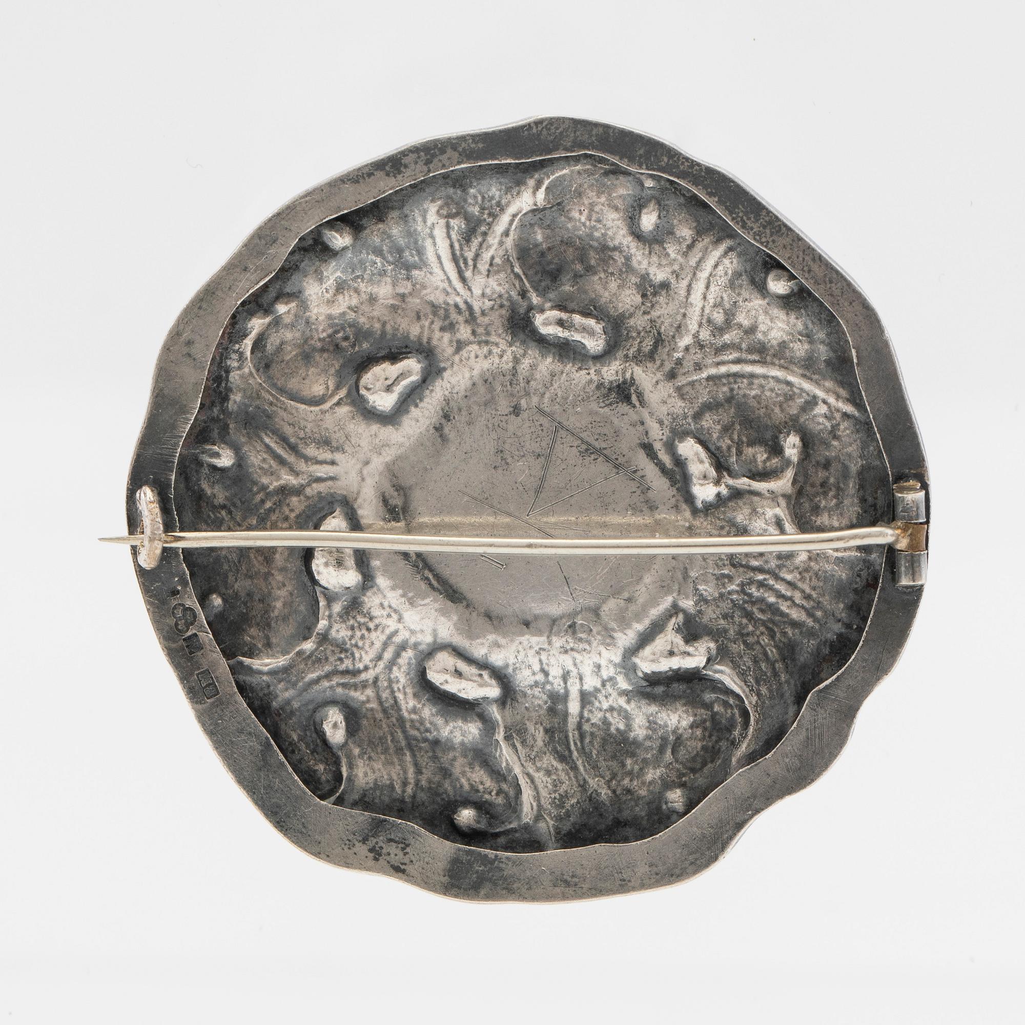 Brosch, silver med grön sten.