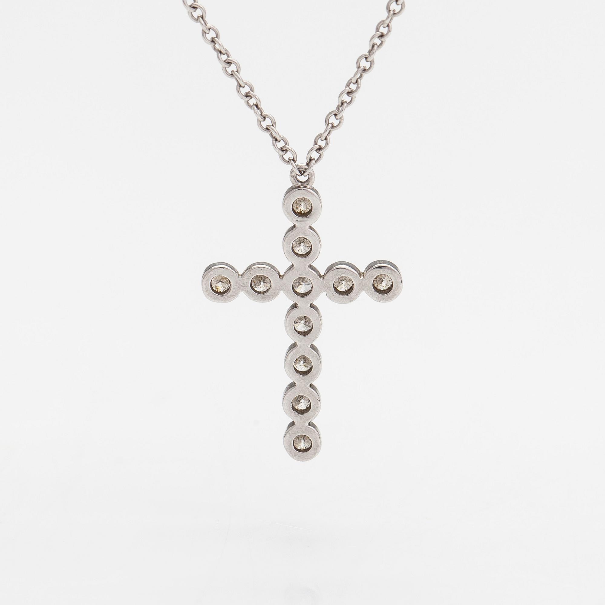 Tiffany & Co, a platinum necklace, 'Jazz Cross' with diamonds approx 0.20ct in total.